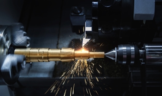 CNC turning machine in action with sparks