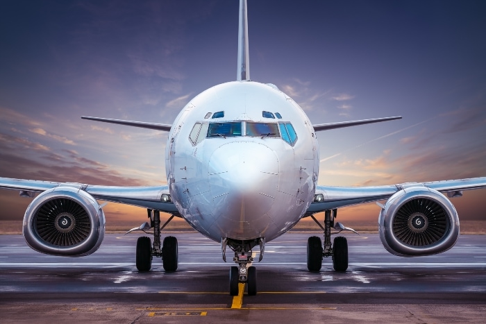 commercial airplane grounded during sunset